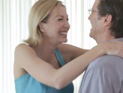 Caucasian man giving necklace to wife Stock Footage