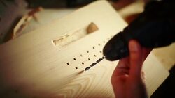 Drilling holes in a wood plank. Stock Footage