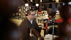 Japanese monk praying in a Japanese temple Stock Footage
