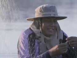 MS fisherman untangling net / Vientiane, Laos Stock Footage
