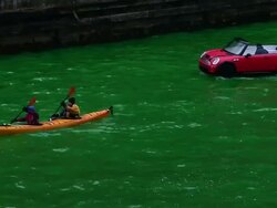 Chicago River Dyed Green In St. Patrick's Day Tradition Stock Footage