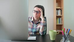 Bored woman in front of the computer. Stock Footage