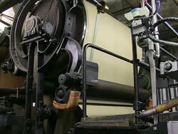 CU Shot of being built paper by machine in paper mill / Gmund, Bavaria, Germany Stock Footage