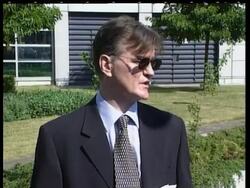 Milosevic arrives at tribunal, lawyers comments. News Clip