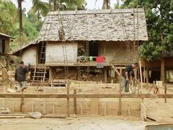 MS SLO MO Shot of two men working at primitive construction site / Mountain village near Muang Ngoi, Luang Prabang, Laos Stock Footage