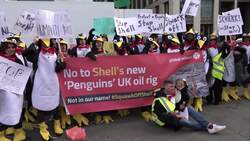 Demonstrators dressed as penguins protest outside Shell HQ News Clip