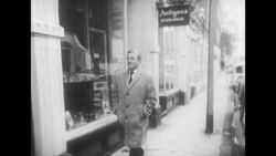 Man Walks Past Antiques Shop in London Street Stock Footage