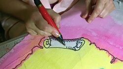 Female hands mark the outline of sketch or pattern with a black marker. Stock Footage