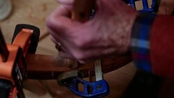 The spindle of a Windsor chair is slotted into place in a workshop. Stock Footage