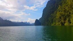 view of landscape limestone mountain rang and green forest with water lake Stock Footage