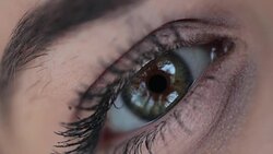 Macro close-up of green female eye outdoors Stock Footage