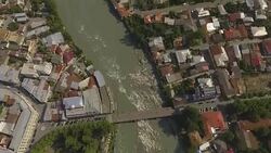 Amazing panorama of Kutaisi city in Georgia, bridges on Rioni river aerial view Stock Footage