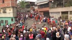 CLEAN : Catholic devotees reenact the crucifixion of Jesus Christ in Venezuelan slum News Clip