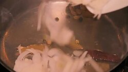 Fried onion with yellow Indian herbs powder with cooking oil in Slow motion. Stock Footage