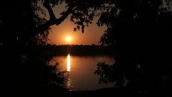 Sun setting over Zamezi River News Clip
