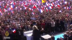 In duelling Paris rallies, Le Pen condemns ‘witch-hunt’, counterprotests News Clip