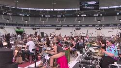 CLEAN : Hundreds of amateur musicians rock out ahead of Paris concert News Clip