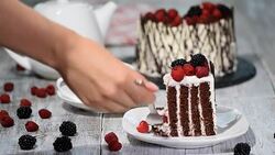 Trendy rustic vertical roll high cake with chocolate, vanilla cream and berries. Stock Footage