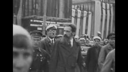 Tall, bearded man walks with Soviet military officials in Moscow News Clip