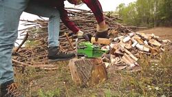 Lumberjack fixing / maintain the chainsaw outdoors. Stock Footage