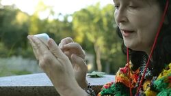 Adult stylish woman in cowboy hat and a multi colored poncho Stock Footage