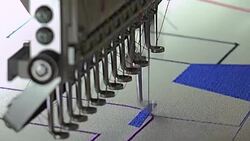 Automatic modern sewing machine embroider a pattern,Industrial embroidery equipment. Textile Manufacturers.Industrial textile factory,Textile Factory. Textile Industry. Stock Footage