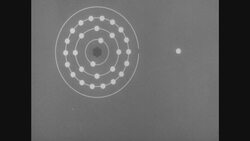 1950s: Illustration of copper atom with text Stock Footage