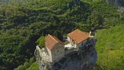 Katskhi Pillar with ancient church on top in Caucasian mountains in Georgia Stock Footage