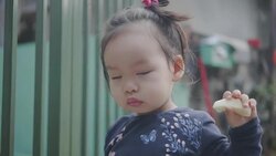 Happy Asian baby girl eating food at home. Concept : Food,Family,life. Stock Footage
