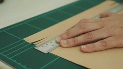 Woman artist is cutting paper Stock Footage