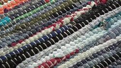 Rotating Vintage knitted handmade carpet background Stock Footage
