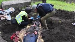 CLEAN : The bodies of civilians allegedly shot by Russian tank exhumed in Stepanki News Clip