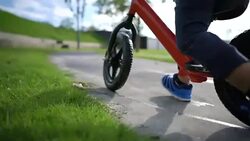 Toddler riding balance bike. Stock Footage