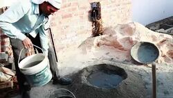Worker mixing cement on construction site. Stock Footage