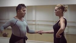 Man and a woman are dancing in the studio Stock Footage