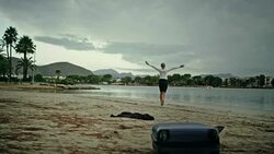 Businesswoman running away to the beach Stock Footage