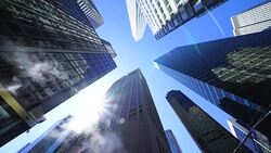 The sun shines and illuminates the steam from interval of the Midtown Manhattan skyscrapers at New York NY USA on Apr. 23 Stock Footage