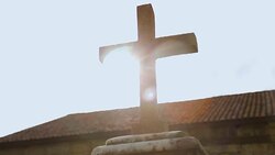 Sunlit stone cross, Christian religion symbol blessing and faith in powerful God Stock Footage