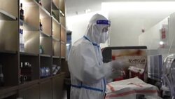 CLEAN : The Olympic cocktail: Bartenders at Beijing Games mix drinks wearing hazmat suits News Clip