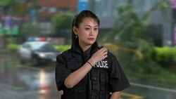 Asian American Woman Police Officer at Crime scene Talking on CB Radio Stock Footage