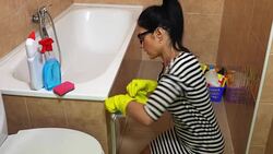 Woman cleaning bathroom Stock Footage