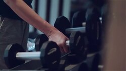 Dumbbells sports and fitness weight training equipment Stock Footage