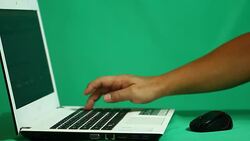 Using laptop  trading  stock exchange Stock Footage