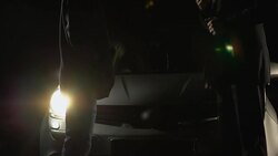 Male in suit giving photo of future victim to contract killer near car at night Stock Footage