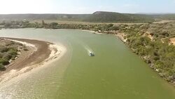 AERIAL boat on estuary/ Port Elizabeth/ South Africa Stock Footage