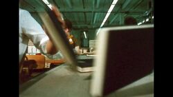 UNITED STATES 1960s: Camera on conveyor belt with books. Stock Footage
