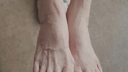 Senior Asian woman got Pain in feet finger joints , Gout Stock Footage