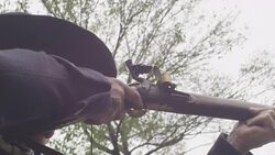 Fire and smoke from musket fired by Revolutionary War soldier Stock Footage