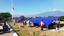 CLEAN : People camp outside after Indonesian tsunami News Clip