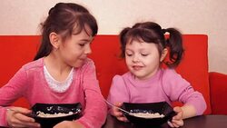 Funny children have breakfast Stock Footage